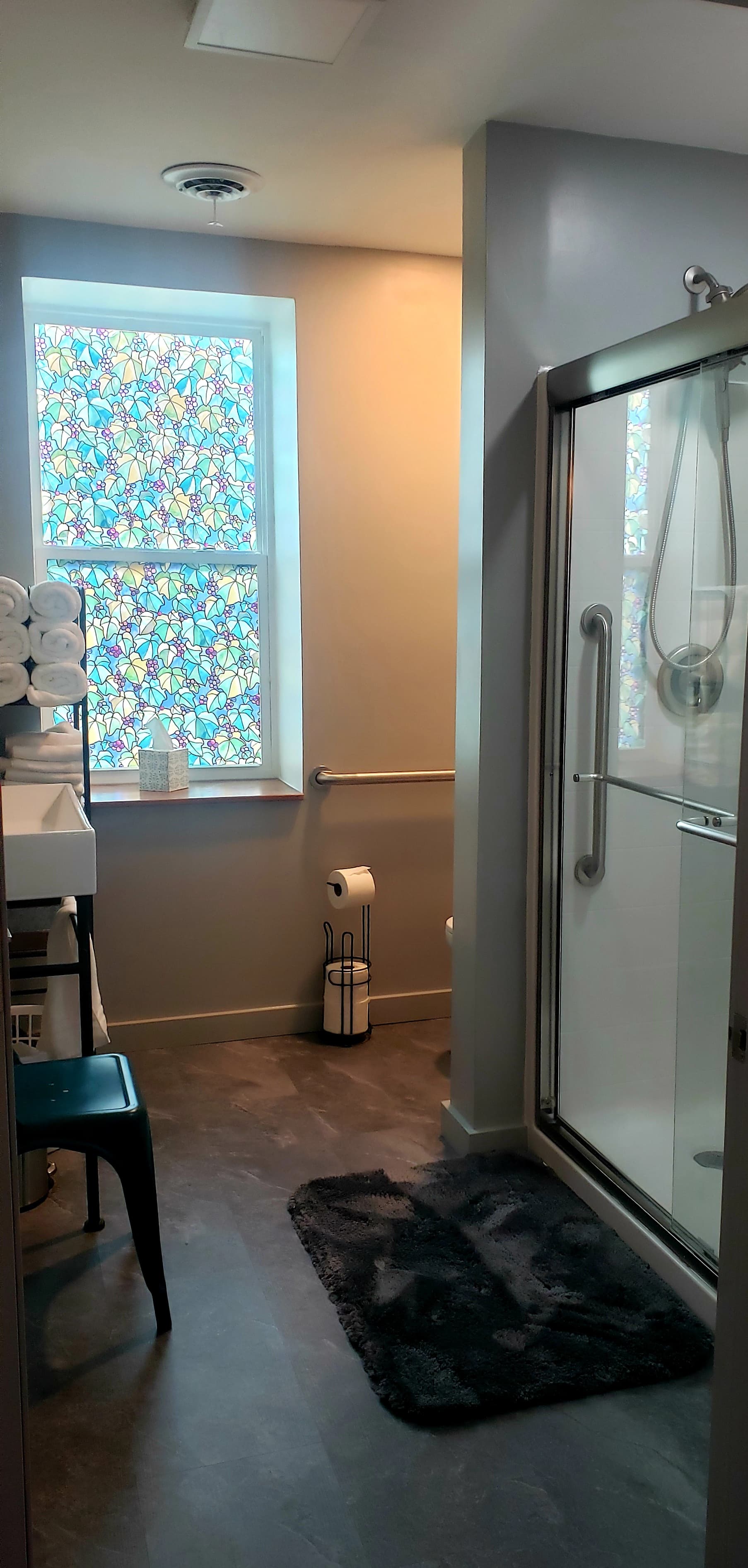 Bathroom with walk in shower with bench